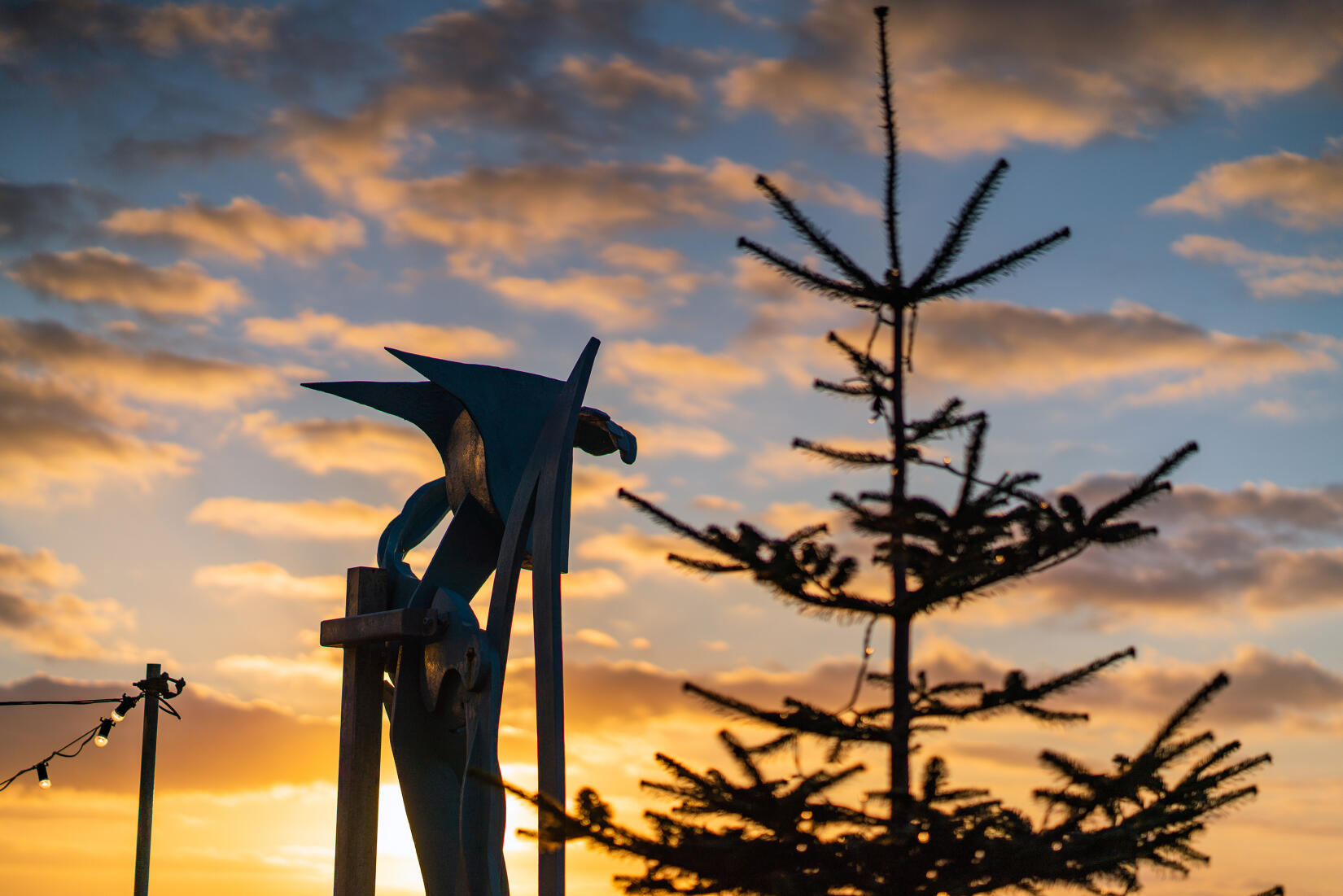 The Warrior of the Surf sculpture overlooking the beach at Christmas