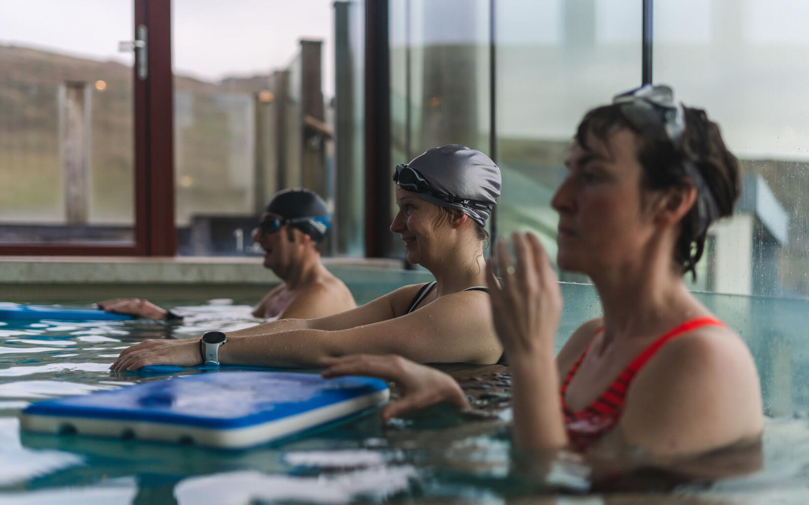 Three people in the swimming pool at Watergate Bay