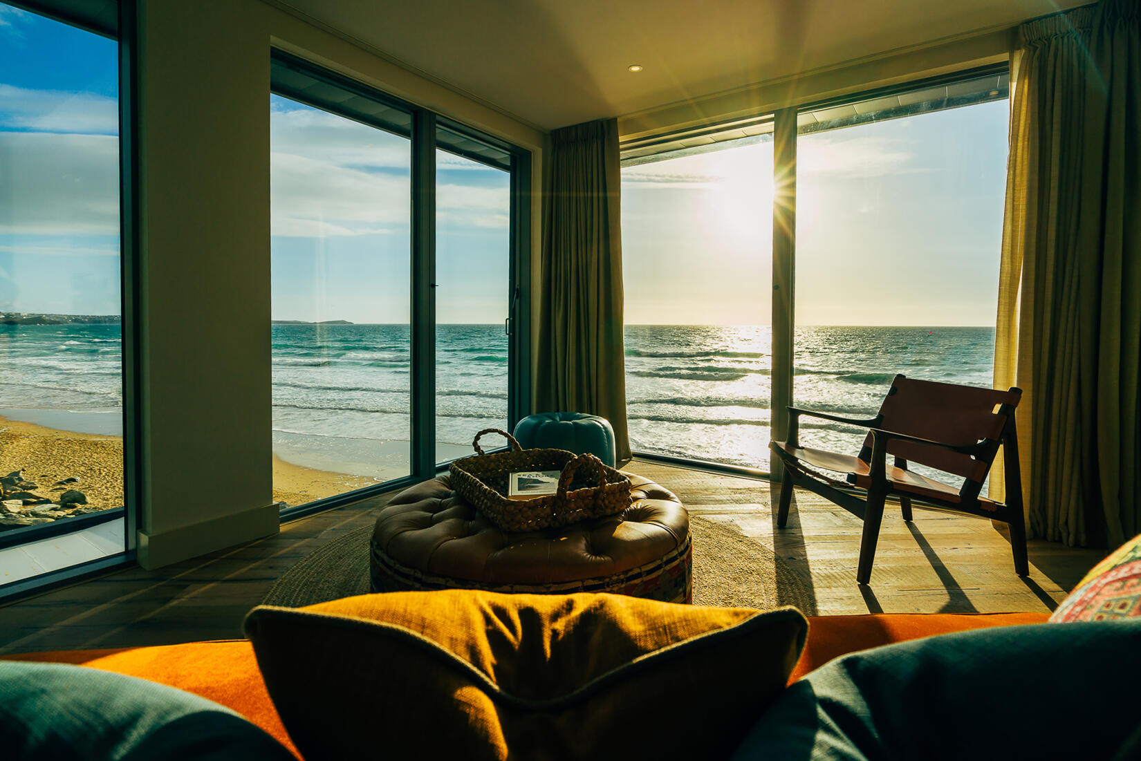 View of the sunset over the sea from a beach loft