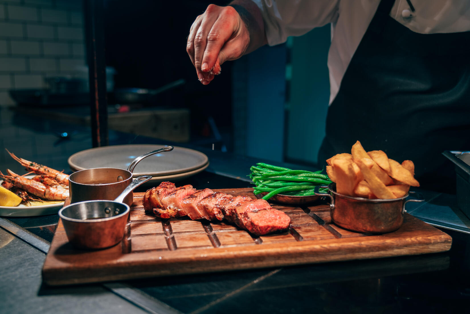 A steak sharing board seasoned with salt