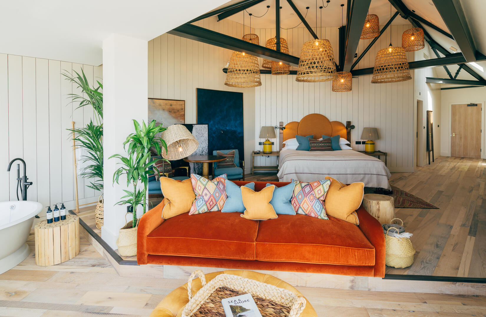 Main bedroom and living area in a couple beach loft suite