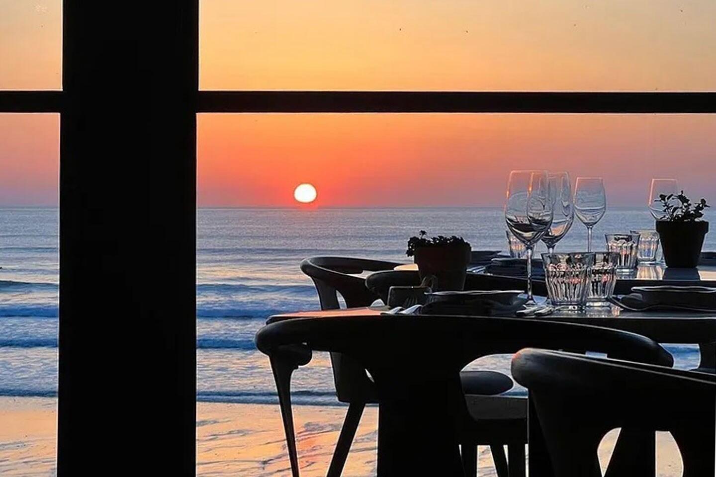 Sunset on the deck at Restaurant Emily Scott overlooking the sea