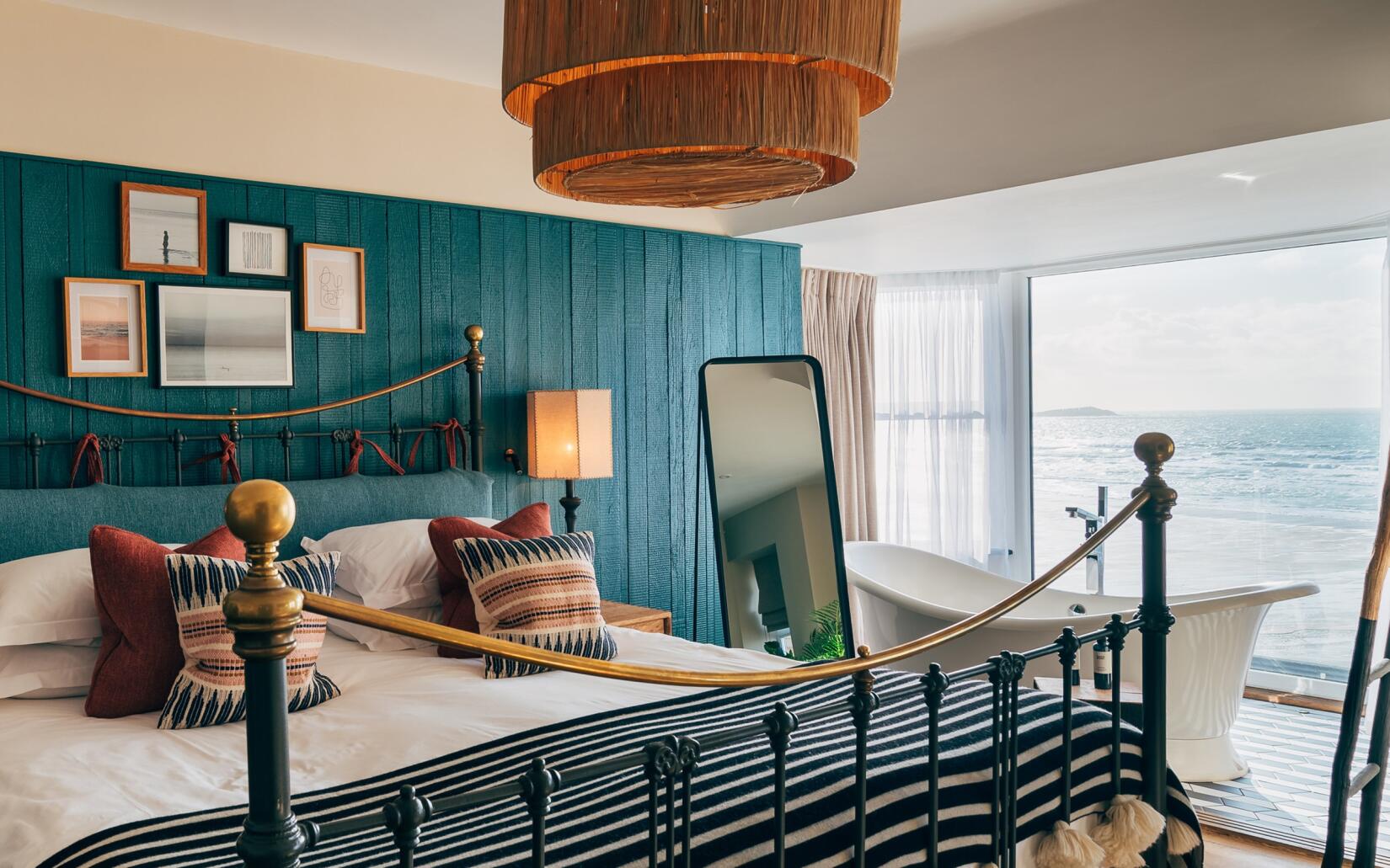 Views over the beach and sea from a suite bedroom