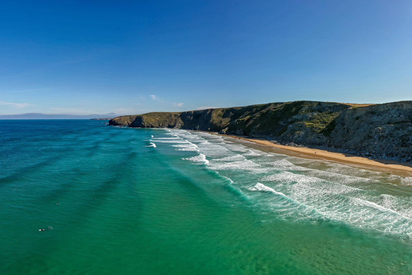 Aerial drone image of Watergate Bay sea, beach and cliffs