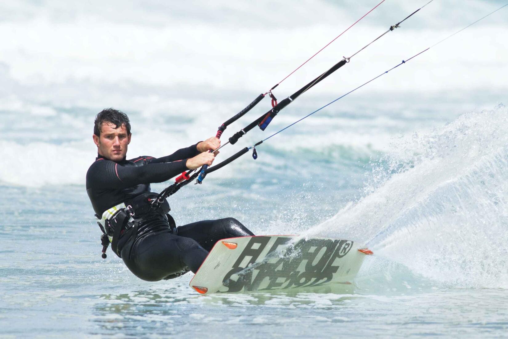 Man kite surfing at Watergate Bay