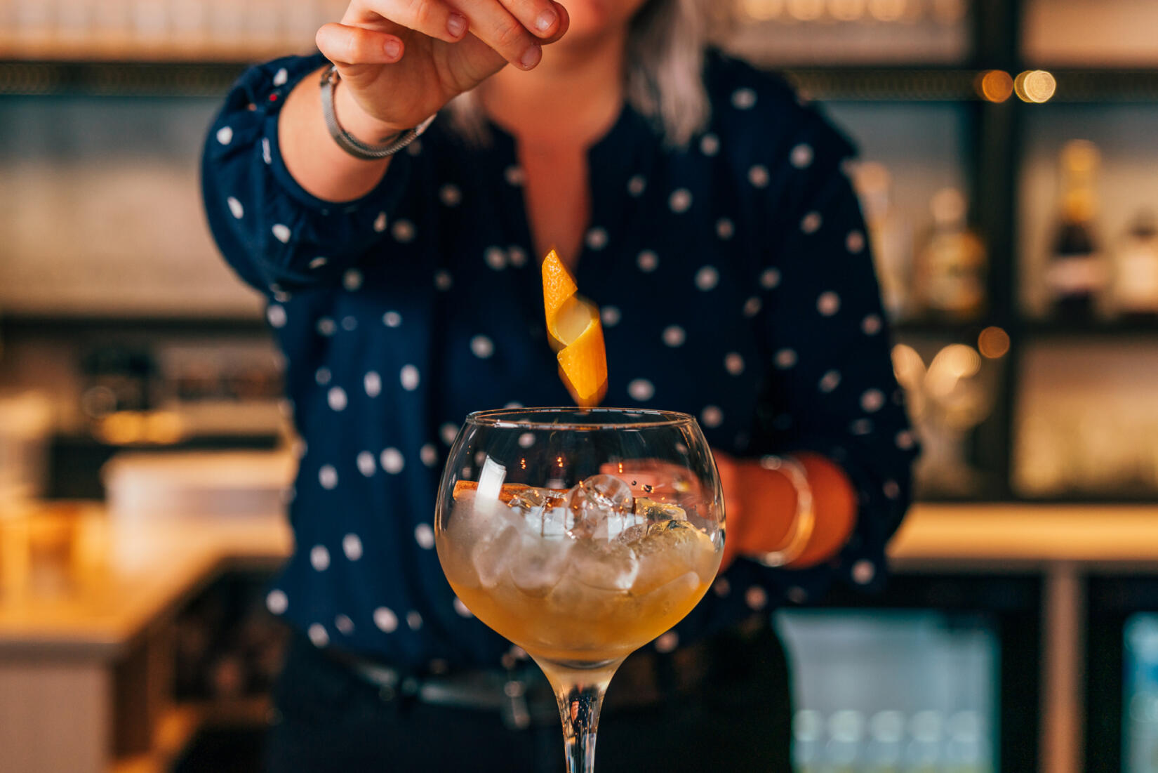 Christmas pudding gin in a gin glass with a twist of zesty orange peel