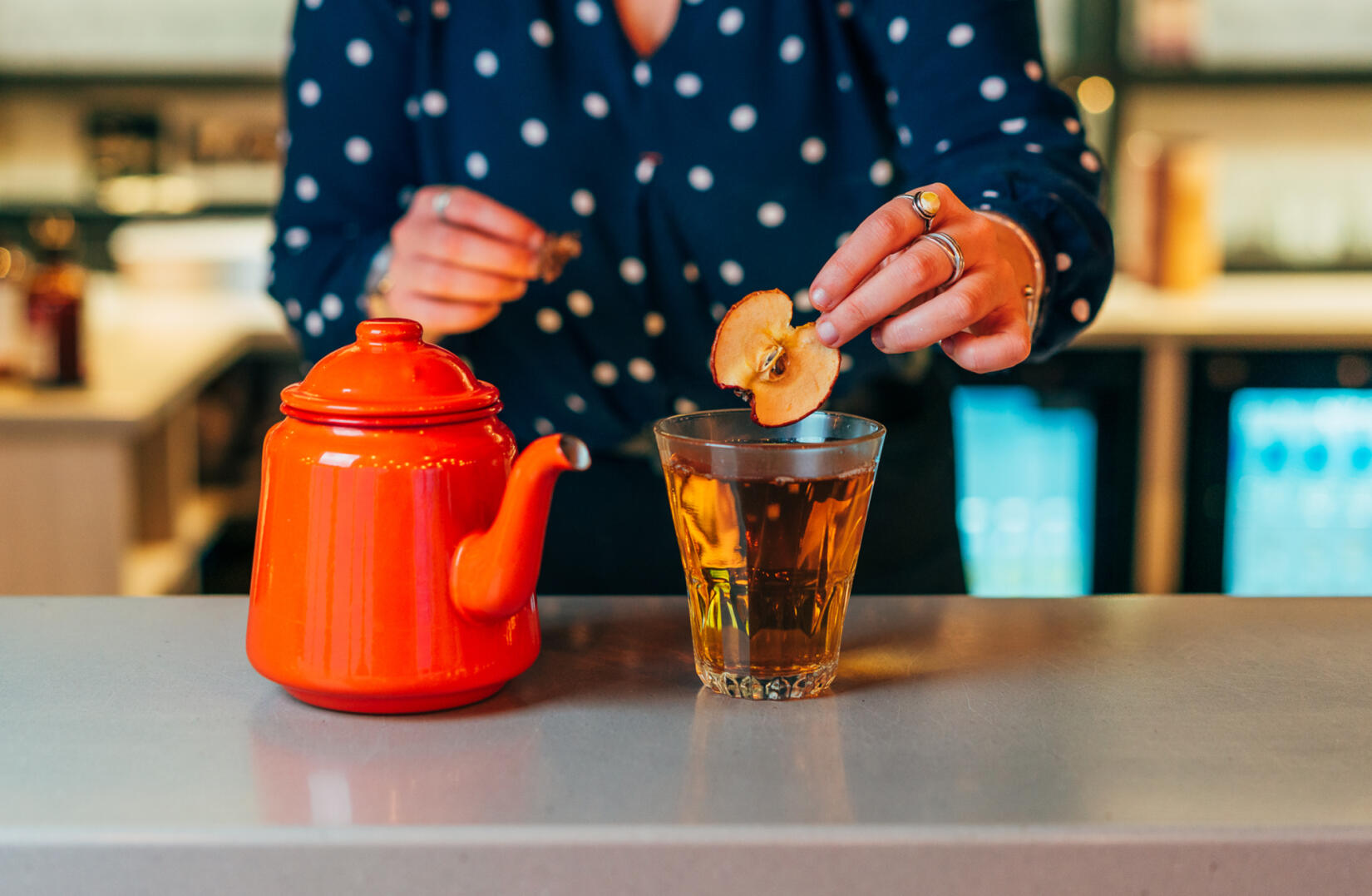 Tea pot and Cornish Christmas punch cocktail with an apple slice