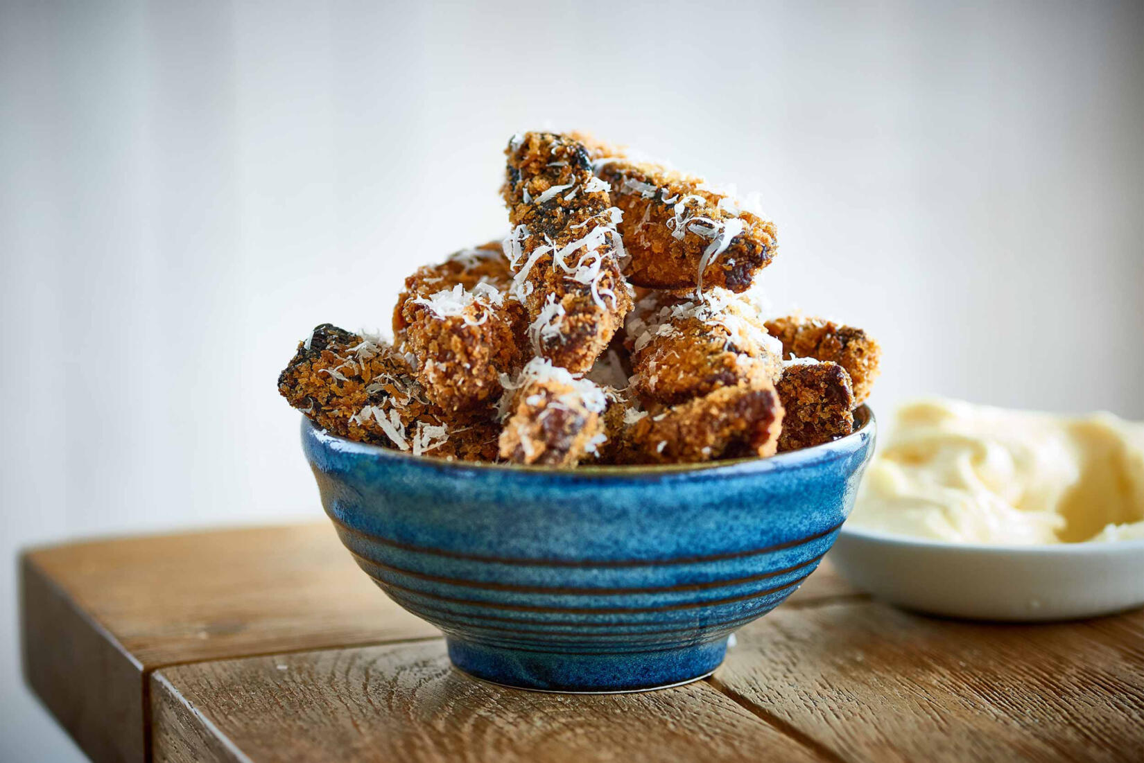 Portobello mushroom fries in a bowl with aioli