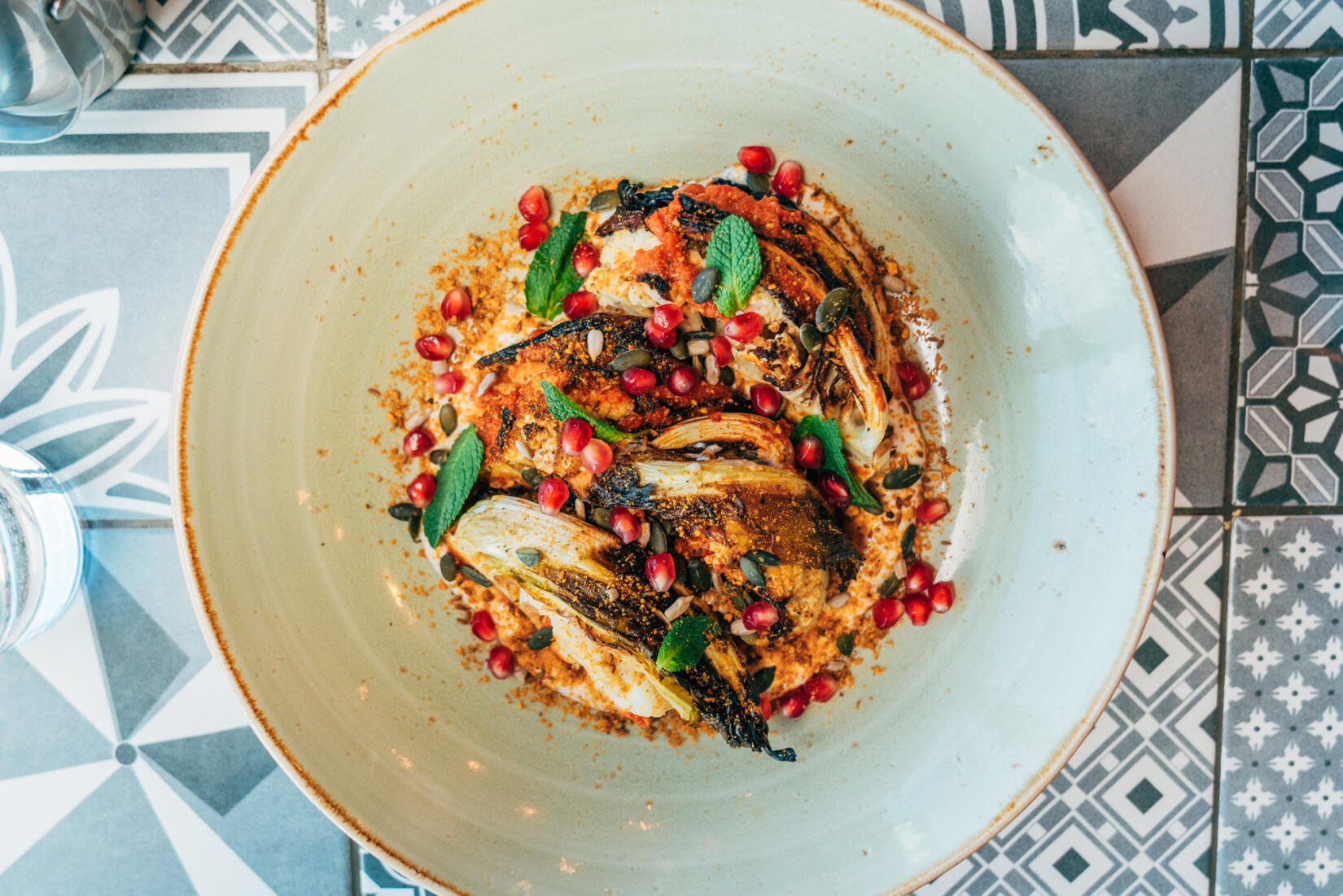 Plate of roasted cauliflower and pomegranate seeds