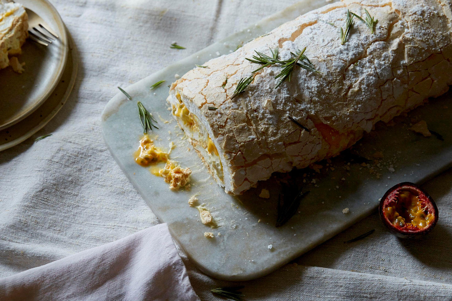 A log of meringue roulade with clementine curd