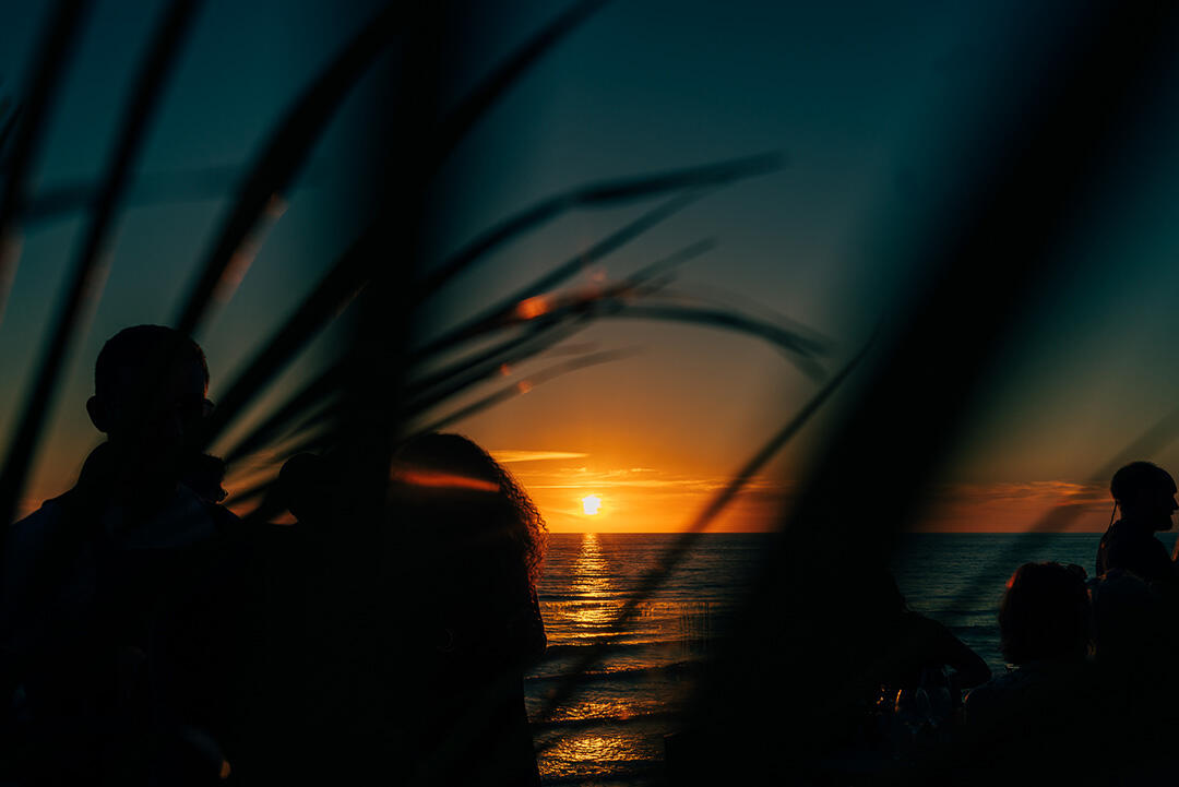 Image of people looking at a sunset