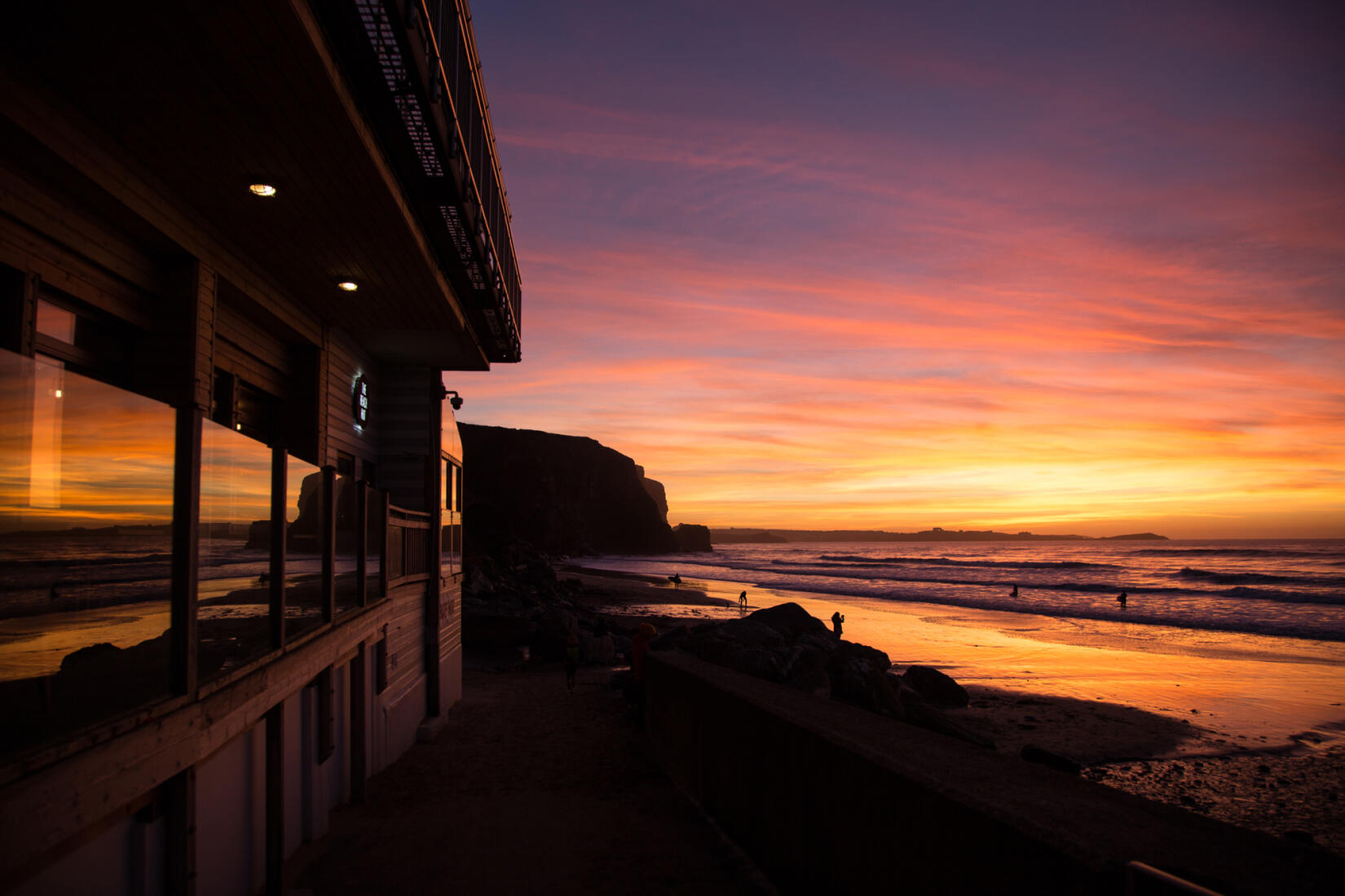 The Beach Hut overlooking Watergate Bay at sunset