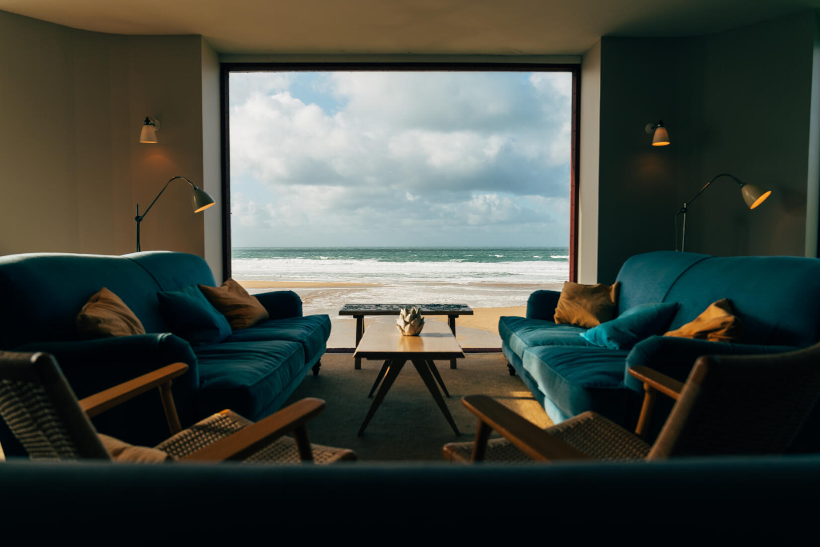 Ocean room armchairs looking out to a stormy sea view