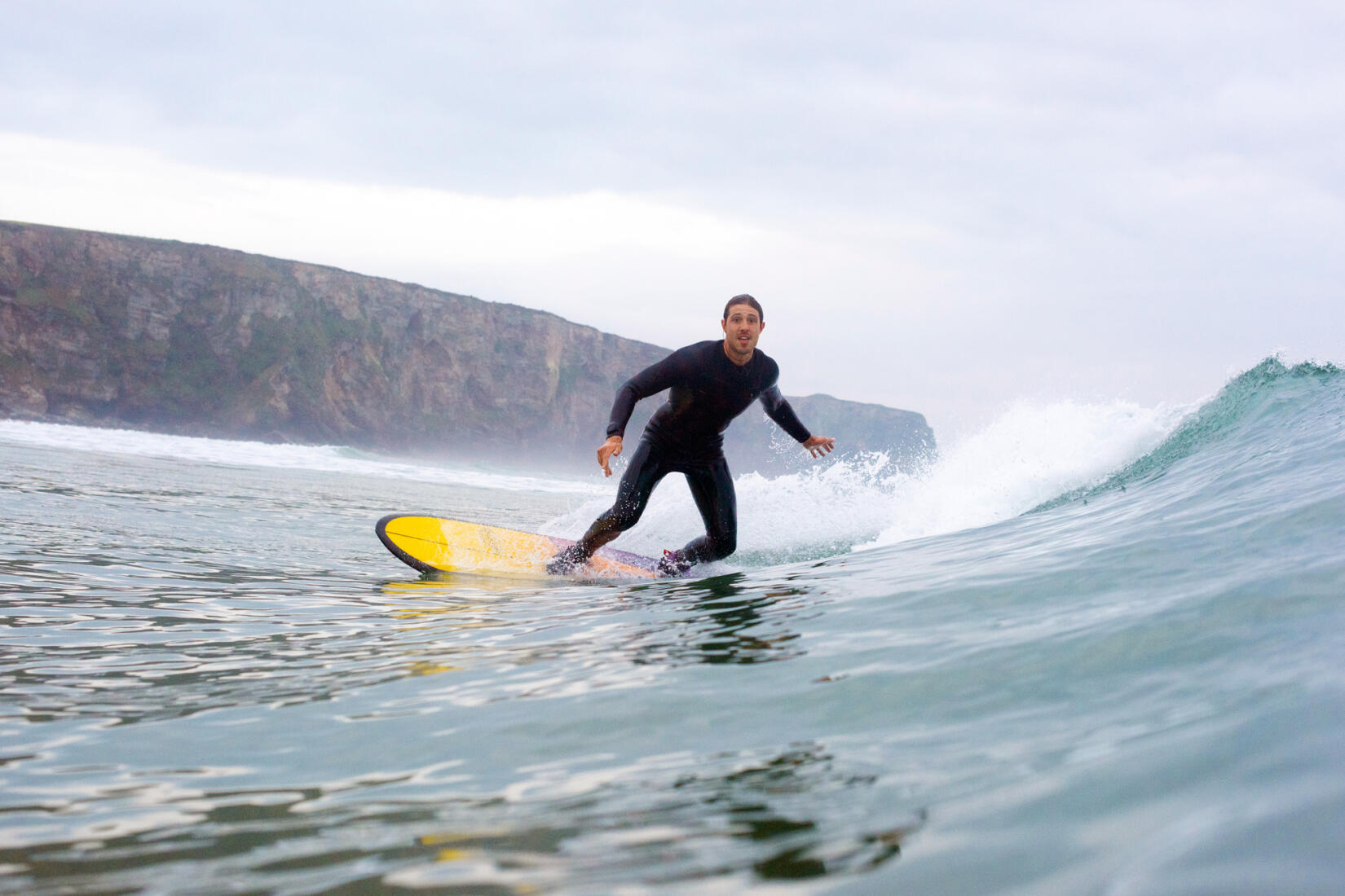 Surfer at Watergate Bay in Cornwall