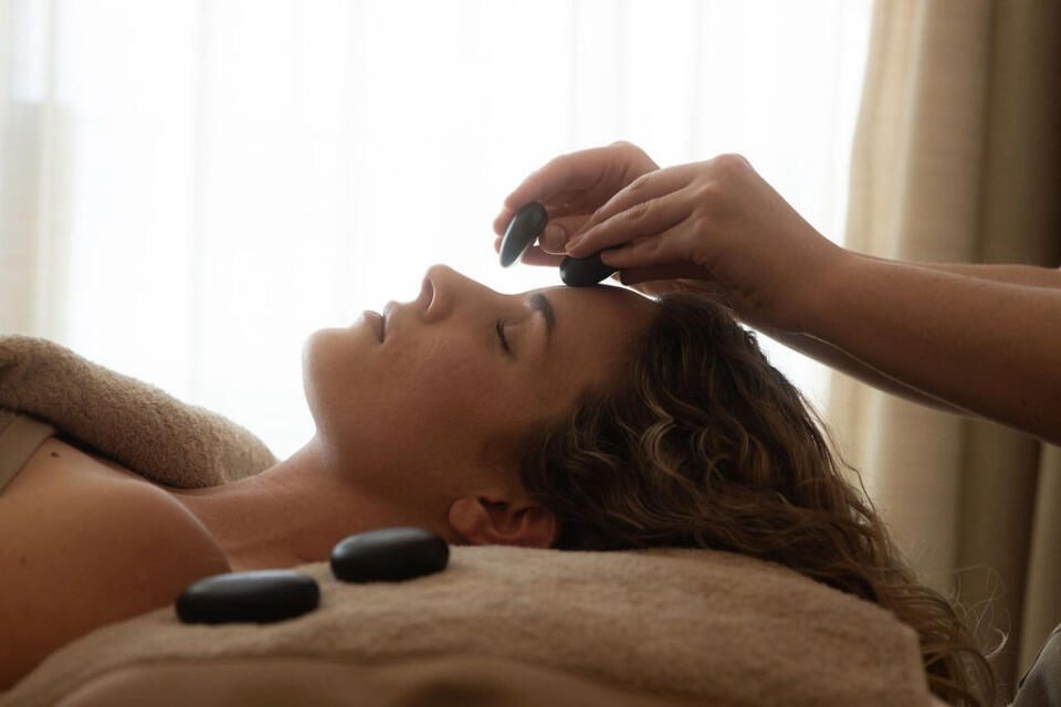 Hot stone facial massage at Swim Club Watergate Bay